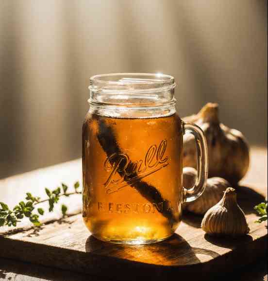 Natural Antibiotic Recipe | Easy Homemade Powerful 4 Natural Antibiotic Recipe in mason jar with warm rustic background and fresh garlic