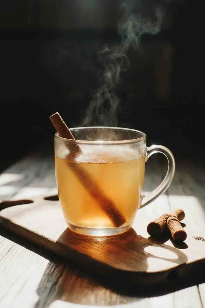 Turmeric tea recipe: How 5 ingredients create magic 5 turmeric tea recipe served in a mug with steam and cozy background